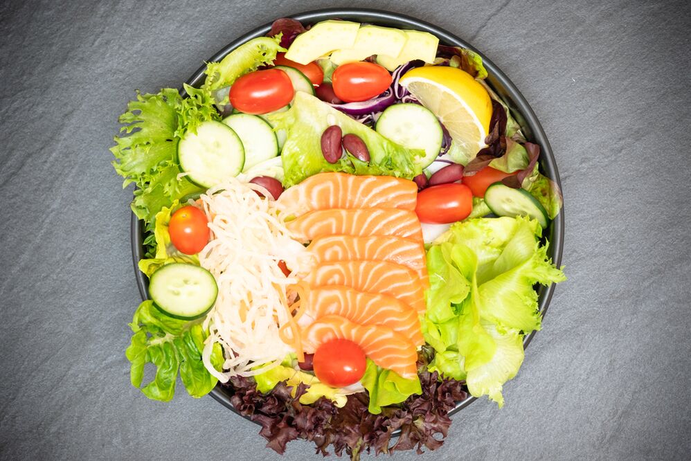 Delicious salad with salmon in the menu of proper nutrition for weight loss
